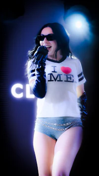 a woman is holding a microphone